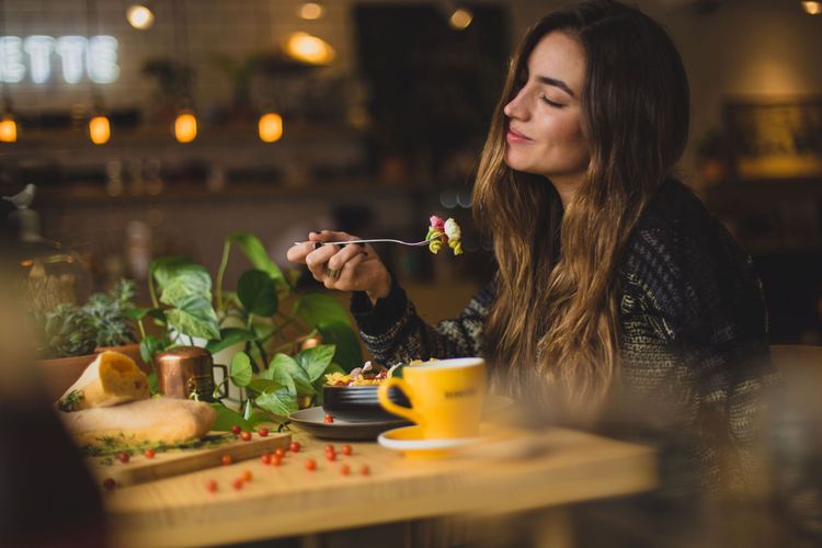 Woman looking joyful while eating
