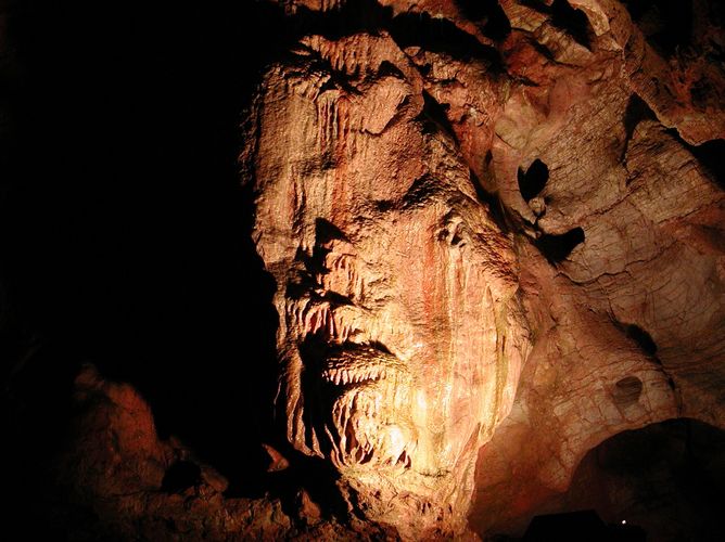 Rock formation that looks like a face in cave wall