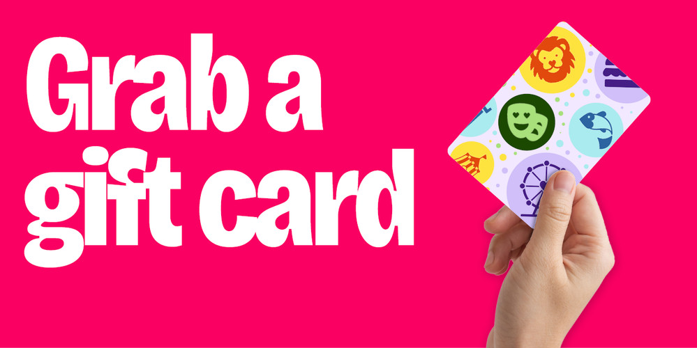 hand holding up a lovetovisit gift card
